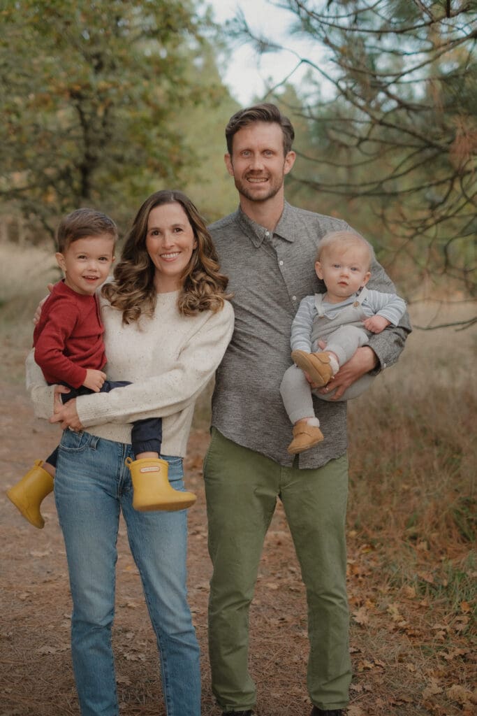 A family standing on a trail