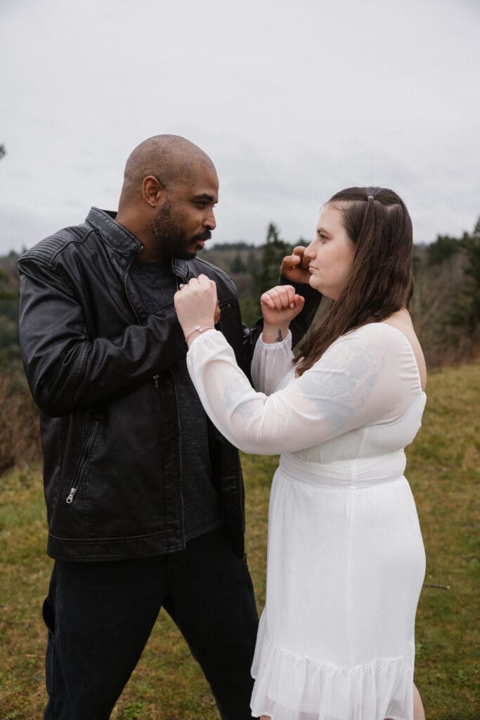 Playful portrait of couple posing together at Portland Women’s Forum State Scenic Viewpoint in Corbett, Oregon.