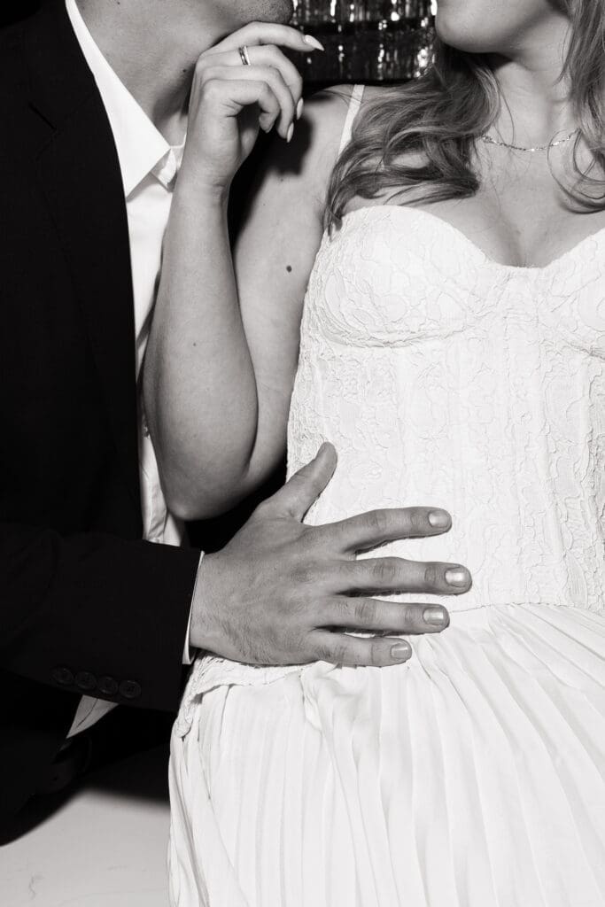 Black and white close-up of couple embracing at The Arc Light in Oregon City, Oregon