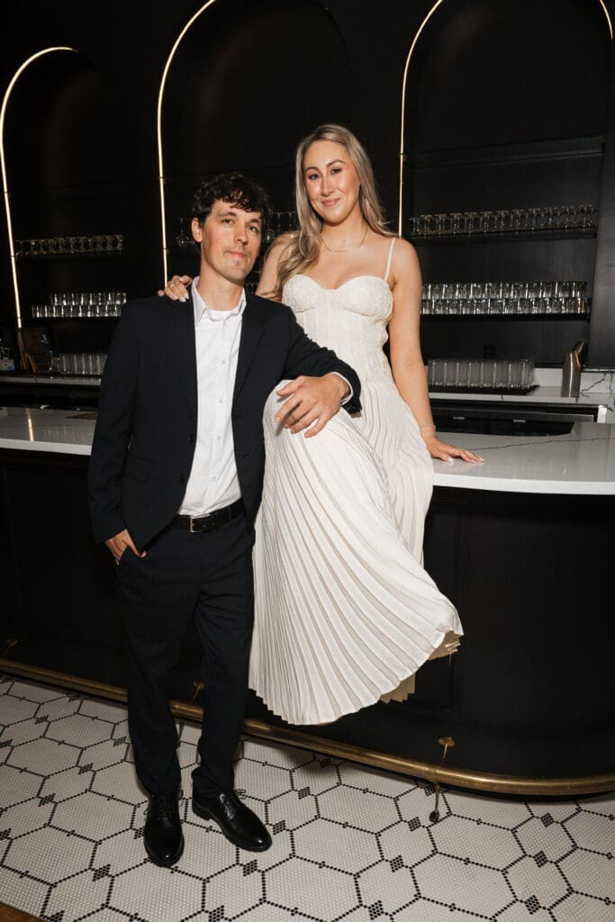 Couple posing together at cocktail bar inside The Arc Light in Oregon City, Oregon