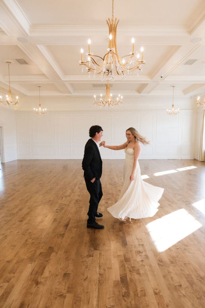 Couple dancing in ballroom during engagement session at The Arc Light in Oregon City, Oregon