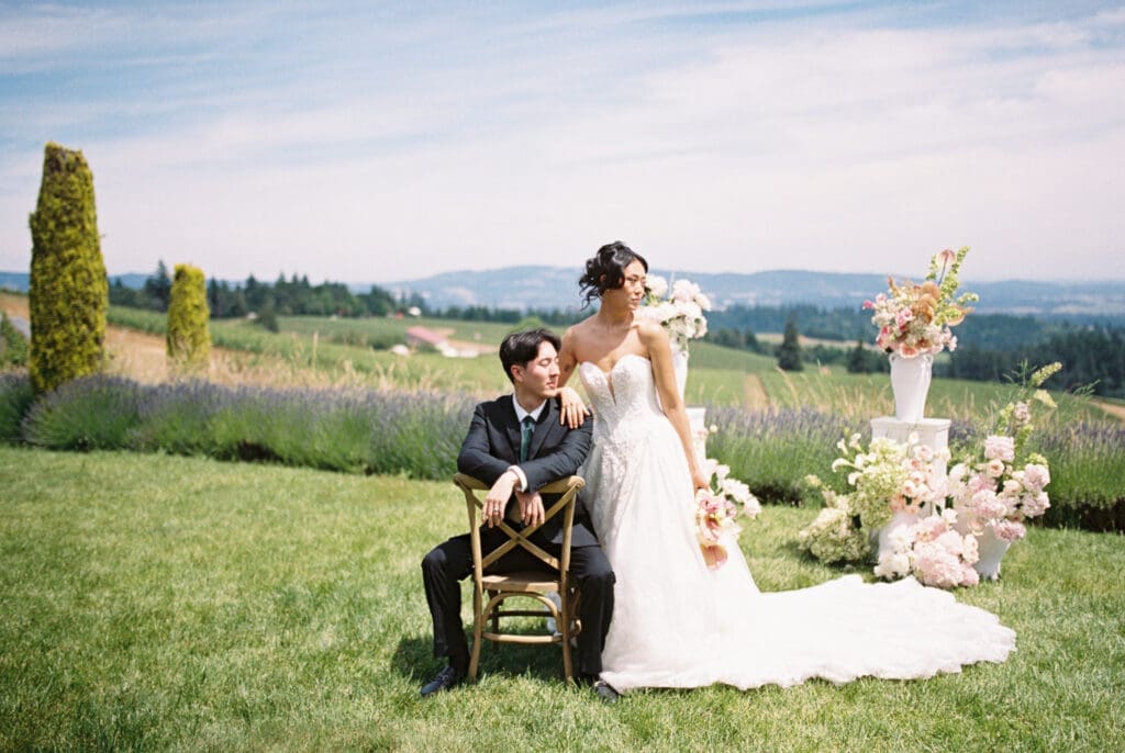 Bride and groom posing with garden-inspired florals during a film wedding editorial at Black Walnut Inn & Vineyard in Dundee, Oregon.